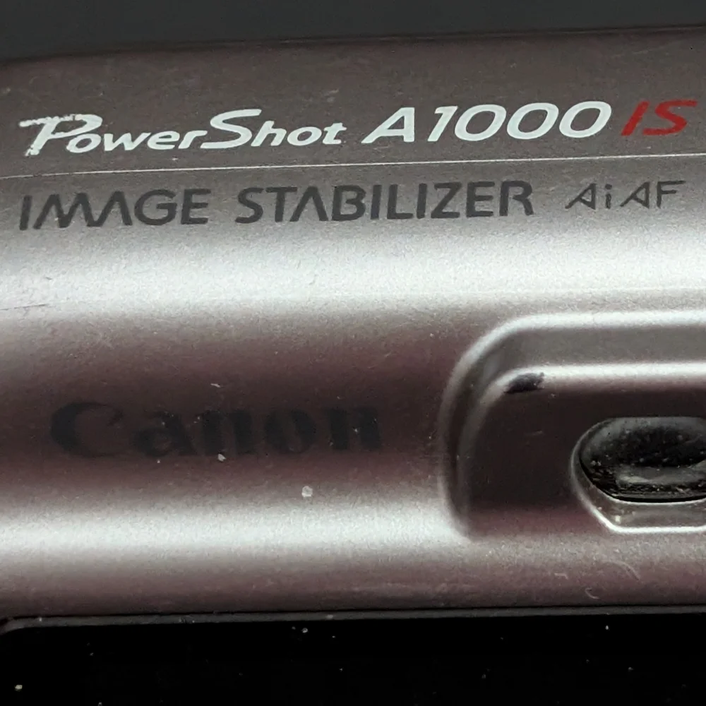 Canon PowerShot A1000 IS PC1309 10 MP optical zoom camera FOR PARTS ONLY 22026D4